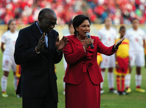 Photo: Former Trinidad and Tobago Prime Minister Kamla Persad-Bissessar (right) and her then Minister of Works and Transport Jack Warner at the Trinidad and Tobago 2010 Women's Under-17 World Cup. (Courtesy FIFA.com)