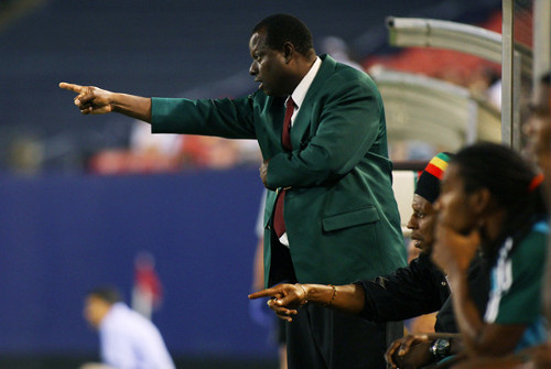 Photo: DIRECTV W Connection coach Stuart Charles-Fevrier (standing) points the way for his troops. At his side is current Trinidad and Tobago National Under-20 coach Brian Williams.