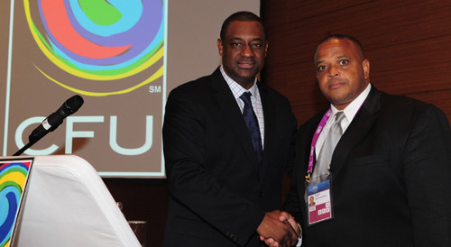 Photo: CONCACAF President Jeffrey Webb (left) congratulates freshly minted CFU President Gordon Derrick in 2012.