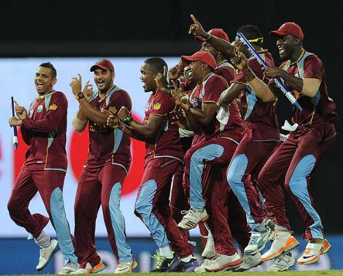 Photo: Sunil Narine (far lest) and the West Indies team celebrate their World T20 success in 2012. (Courtesy khelnama.com)