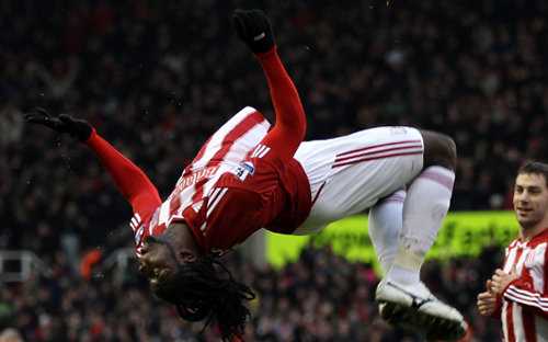 Photo: Trinidad and Tobago attacker Kenwyne Jones jumps for joy during his spell with Stoke City. (Courtesy Ross Kinnaird/ Getty Images)