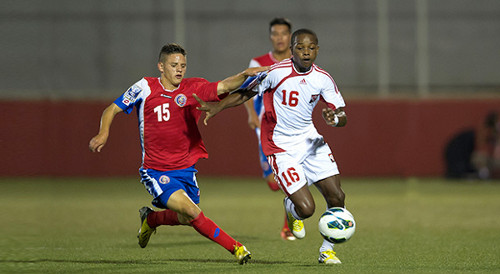 Photo: Trinidad and Tobago midfielder Levi Garcia (right) takes on a Costa Rican opponent during the 2013 Under-17 CONCACAF tournament. (Courtesy CONCACAF.com)