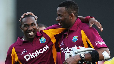 Photo: West Indies allrounder Dwayne Bravo (left) gets support from his Trinidad and Tobago teammate Kieron Pollard during a One-day International game for the West Indies in India.