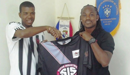 Photo: Central FC managing director Brent Sancho (right) offers a club shirt to Trinidad and Tobago national youth attacker Dwight Quintero. (Courtesy Central FC)