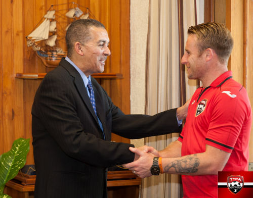 Photo: Soca Warrior Chris Birchall (right) meets Trinidad and Tobago president Anthony Carmona on the eve of his farewell match in Port of Spain in November 2013. (Courtesy TTFA Media)