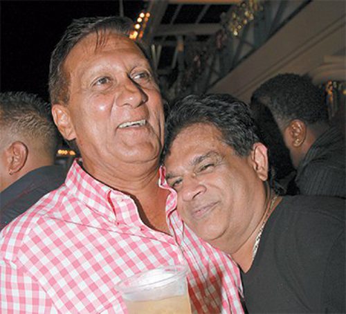 Photo: Former Health Minister Dr Fuad Khan (right) shares a tender moment with UNC financier Ish Galbaransingh, who is wanted for corruption by the United States Government. (Copyright Trinidad Guardian)