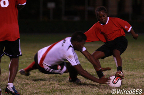 Photo: Tranquility Secondary student Che Benny evades television presenter James Saunders during the 2014 Wired868 Football Festival. Benny won an Easi-Pharm hamper for his skillful cameo. (Courtesy Allan V Crane/Wired868)