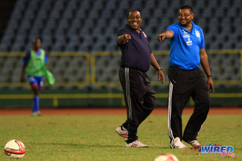 Photo: Morvant Caledonia United co-founder and technical director Jamaal Shabazz (left) and head coach Rajesh Latchoo—then head and assistant coach respectively—enjoy a good day at the office during the 2013/14 Pro League season. (Courtesy Allan V Crane/Wired868)