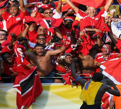 Photo: Ex-Trinidad and Tobago football captain and legend Dwight Yorke (bottom) salutes the "Soca Warriors" fans at the 2006 Germany World Cup. (Copyright AFP 2014/Patrik Stollarz)