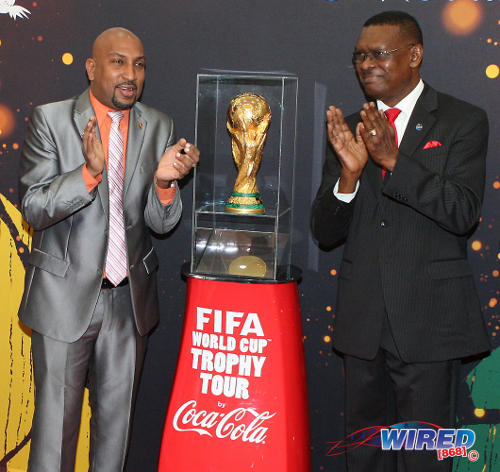 Photo: Former Port of Spain mayor Raymond Tim Kee (right) and ex-Sport Minister Anil Roberts at the FIFA World Cup trophy tour in 2013. (Courtesy Wired868)