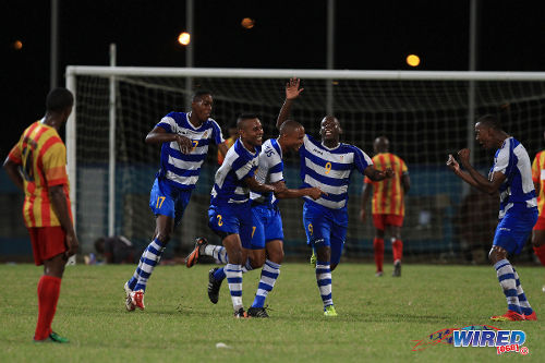 Photo: Defence Force players (from left) Ross Russell Jr, Curtis Gonzales, Balondemu Julius and Devorn Jorsling celebrate against Point Fortin Civic during the 2013/14 Pro League season. (Courtesy Allan V Crane/Wired868)