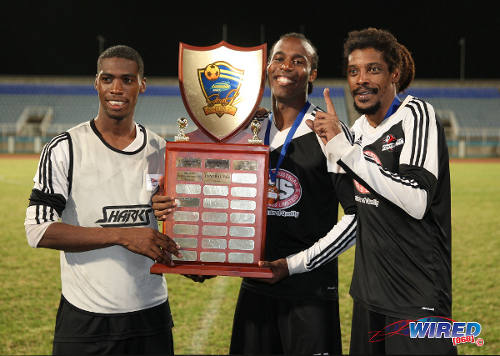 Photo: Then Central FC players (from left) Elton John, Yohance Marshall and captain Marvin Oliver pose with the 2014 Lucozade Sport Goal Shield trophy. (Courtesy Allan V Crane/Wired868)