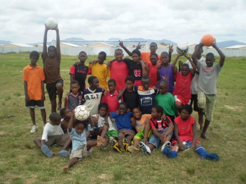 Photo: The first Crown Trace FC team photo. Tishawn Miller, who was shot dead by police in 2013, is holding an orange football on the far right.