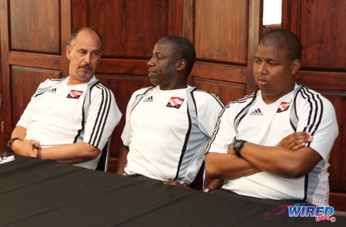 Photo: Trinidad and Tobago national head coach Stephen Hart (left) addresses the media with assistants Hutson Charles (centre) and Derek King during a press conference in June 2013. (Courtesy Wired868)