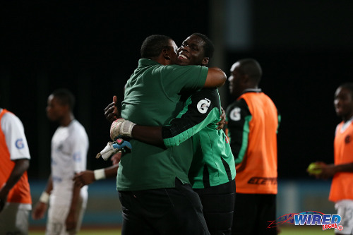 Photo: W Connection chairman David John Williams (left) hugs goalkeeper Julani Archibald after the 2015 Pro Bowl Cup final. (Courtesy Allan V Crane/Wired868)