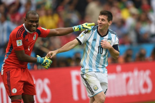 Photo: Argentina captain Lionel Messi (right) and Nigeria goalkeeper Vincent Enyeama share a light moment during their Group F contest at the 2014 World Cup. (Copyright AFP 2014/Pedro Ugarte)