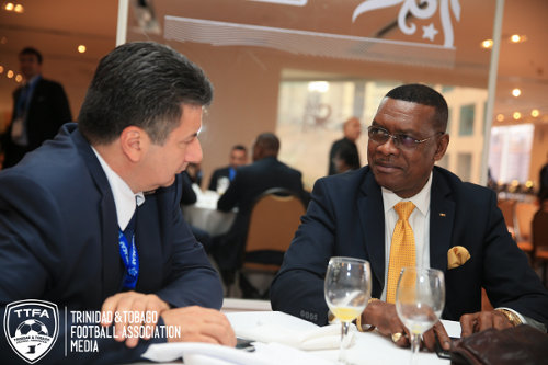 Photo: Former Port of Spain mayor and ex-Trinidad and Tobago Football Association (TTFA) president Raymond Tim Kee (right) enjoys some conversation at the 2014 FIFA Congress in Sao Paulo, Brazil. (Copyright TTFA Media)