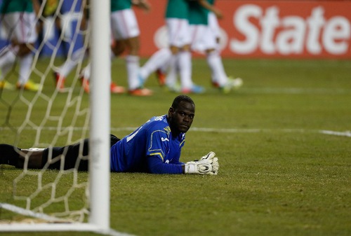 Photo: Trinidad and Tobago goalkeeper Jan-Michael Williams muses over Mexico's decisive goal in the 2013 CONCACAF Gold Cup quarterfinal. (Copyright Getty Images/AFP/ Mike Zarrilli)