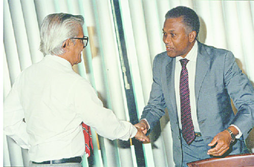 Photo: Late Prime Minister Arthur NR Robinson (right) is greeted by then Cabinet colleague and subsequent Prime Minister Basdeo Panday. (Courtesy Trinidad Guardian)