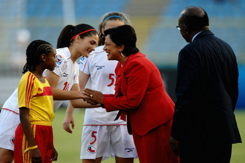 Photo: Then Prime Minister Kamla Persad-Bissessar (centre) makes an appearance alongside former Cabinet colleague and ex-FIFA vice-president Jack Warner (right) at the launch of the 2010 Under-17 Women's World Cup in Trinidad and Tobago. (Courtesy FIFA)