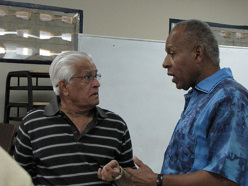 Photo: Former Trinidad and Tobago Prime Ministers Basdeo Panday (left) and Patrick Manning have a chat at a Presentation College reunion. (Copyright Taran Rampersad/Flckr)