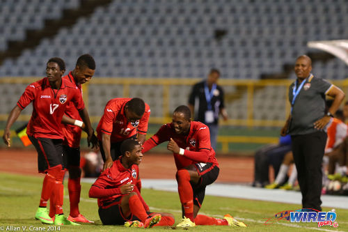 Photo: Then Trinidad and Tobago National Under-20 midfielder Aikim Andrews (seated) celebrates his goal against Curaçao with teammates during the Under-20 Caribbean Championship. (Courtesy Allan V Crane/Wired868)