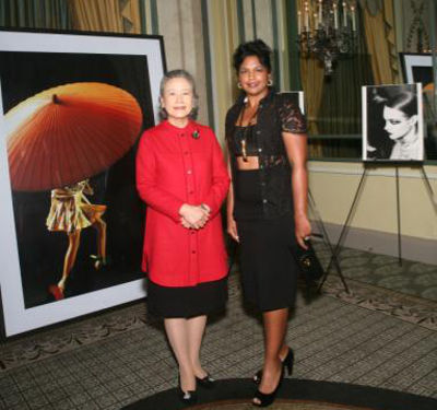 Photo: Reema Carmona (right) poses next to Ban Soon-Taek, the wife of United Nations General Secretary, Mr Ban Ki-Moon, at a UN event on Tuesday 23 September 2014. Rum shop logic is when you hear breakfast function and dress for breakfast fete. (Courtesy Zimbio)