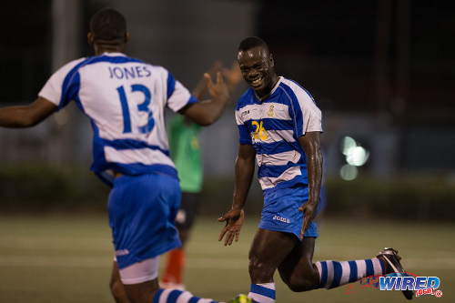 Photo: Defence Force forward Richard Roy (right) celebrates with Marvin Jones during the 2014/15 Pro League season. (Courtesy Allan V Crane/Wired868)