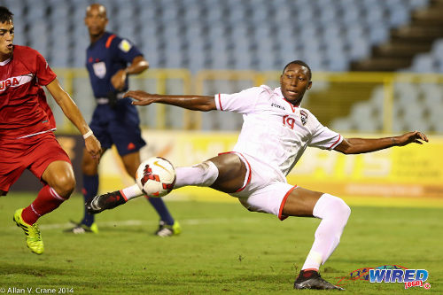 Photo: Trinidad and Tobago National Under-20 forward Nicholas Dillon goes for goal during the 2014 Under-20 Caribbean Cup. (Courtesy Allan V Crane/Wired868)