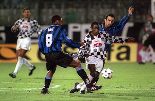 Photo: Trinidad and Tobago playmaker Russell Latapy (centre) shows off his dribbling ability for Portuguese club Boavista against Italy's Inter Milan in European competition. His victims here are former England captain Paul Ince (left) and France World Cup winner Youri Djorkaeff.