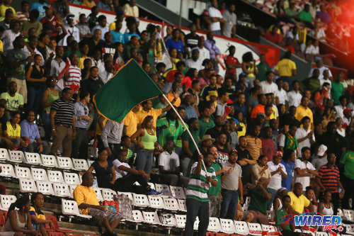 Photo: St Benedict's College supporters cheer their team on in the 2014 National Intercol final at the Hasely Crawford Stadium. (Courtesy Allan V Crane/Wired868)