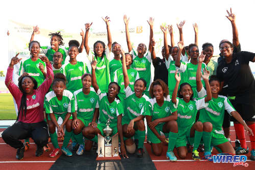 Photo: St Augustine Secondary footballers celebrate with the BGTT 2014 Girls' National Intercol trophy. (Courtesy Allan V Crane/Wired868)