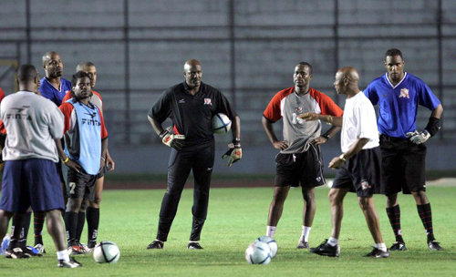 Photo: Coach Bertille St Clair (second from right) has a word with (from right) Shaka Hislop, Stern John, Michael Maurice, David Nakhid, Leslie Fitzpatrick and Clayton Ince during his stint with the Trinidad and Tobago National Senior team. (Copyright AFP 2015)