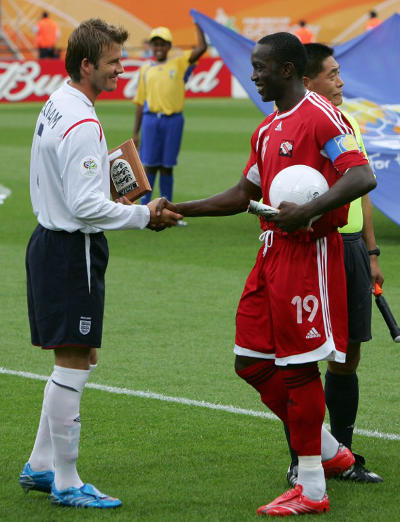 Photo: Ex-Trinidad and Tobago captain Dwight Yorke (right) greets England captain David Beckham during the Germany 2006 World Cup. (Copyright AFP 2015)