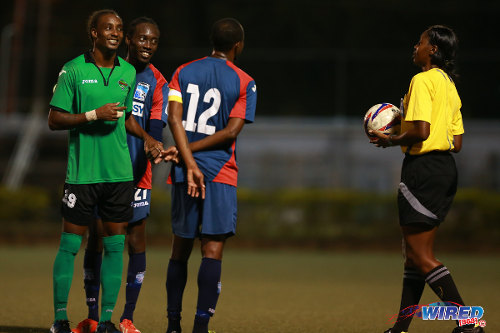 Photo: (From left) San Juan Jabloteh's Tyrone Charles, Caledonia AIA's Nathan Lewis and Kareem Joseph await the verdict of match referee Tricia Des Vignes during 2014/15 Pro League action. Lewis has since joined Charles at Jabloteh. (Courtesy Allan V Crane/Wired868)