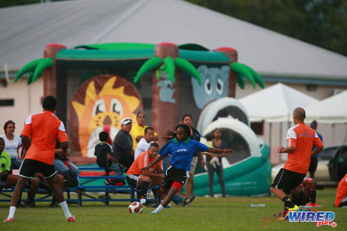 Photo: Trinidad and Tobago National Senior Women's Team attacker Ahkeela Mollon (centre) prepares to cross during the 2015 Wired868 Football Festival at the UWI SPEC ground, St Augustine. (Courtesy Allan V Crane/Wired868)