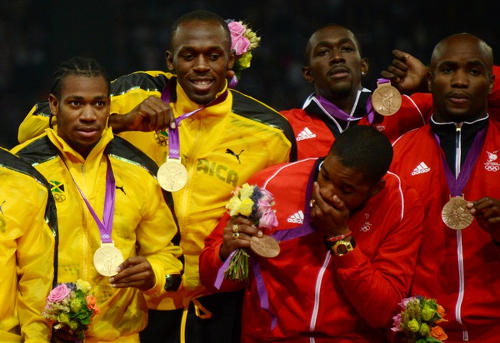 Photo: Jamaica and Trinidad and Tobago sprinters (from left) Yohan Blake, Usain Bolt, Keston Bledman, Marc Burns and Emmanuel Callender show off their gold and bronze medals respectively after the 4x100 final in London 2012. (Copyright AFP 2015)