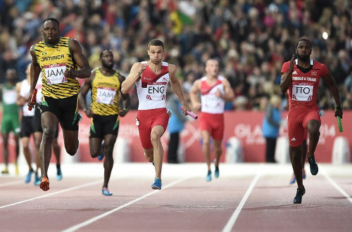 Photo: Trinidad and Tobago sprinter Richard Thompson (far right) chases Jamaican legend Usain Bolt (far right) during the London 2012 Olympics 4x100 metre final. (Copyright AFP 2015)