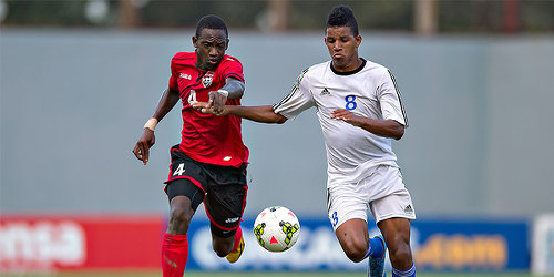 Photo: Trinidad and Tobago National Under-17 defender Tekay Hoyce (left) chases Cuba attacker Yosniel Gonzales during the 2015 CONCACAF Championship. (Courtesy MexSport/CONCACAF)