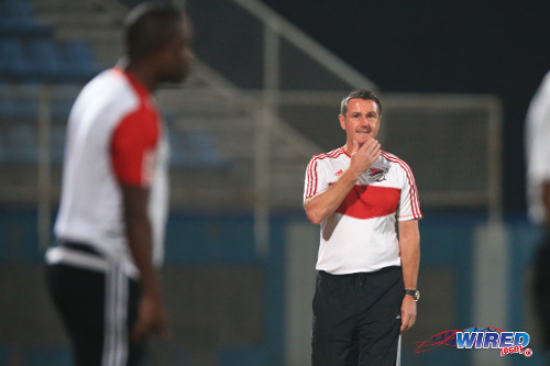 Photo: Former Central FC coach Terry Fenwick gestures during his team's final Pro League contest. North East Stars coach Angus Eve is in the foreground. (Courtesy Allan V Crane/Wired868)