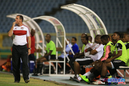 Photo: Then Central FC coach Terry Fenwick (left) whistles from the bench during his team's Pro League contest with Point Fortin Civic in the 2014/15 season. Central won 5-2. (Courtesy Allan V Crane/Wired868)