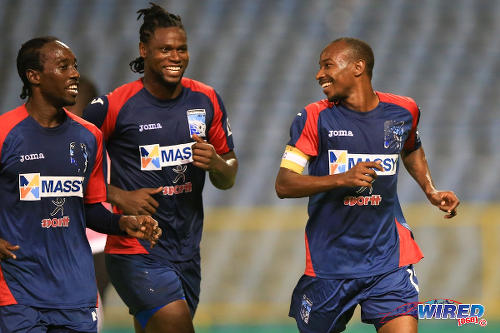 Photo: Caledonia AIA captain Kareem "Tiny" Joseph (right) celebrates his successful penalty kick with teammates Jamil Joseph (centre) and Nathan Lewis in the Digicel Pro Bowl final against Central FC. Caledonia AIA lost 4-1 at the Hasely Crawford Stadium. (Courtesy Allan V Crane/Wired868)