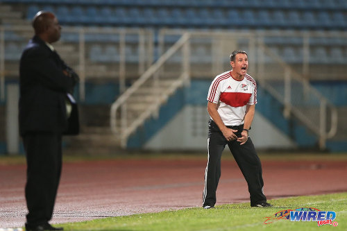 Photo: Central FC coach Terry Fenwick (right) tries to get a reaction from his squad in the 2015 Caribbean Cup final. Looking on is W Connection coach Stuart Charles-Fevrier. (Courtesy Allan V Crane/Wired868)