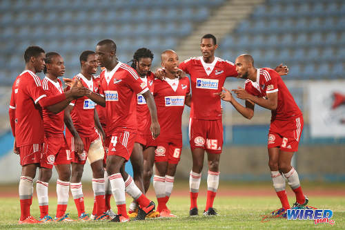 Photo: Central FC players (from left) Elton John, Darren Mitchell, Kaydion Gabriel, Uriah Bentick, Jason Marcano, Leston Paul, Ataulla Guerra and Akeem Benjamin celebrate during their penalty shoot out win over Montego Bay United in the 2015 Caribbean Club Championship semifinal. (Courtesy Allan V Crane/Wired868)