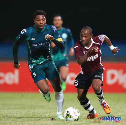 Photo: North East Stars attacker Kennedy Hinkson (right) tries to outrun W Connection defender and captain Mekeil Williams during the 2015 Pro Bowl quarterfinals. (Courtesy Allan V Crane/Wired868)