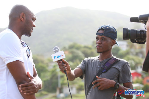 Photo: Football legend Marcus Gayle (left) speaks to Wired868 reporter Roneil Walcott during the Flow Legends Community Legacy Outreach programme at Speyside Recreation Grounds, Tobago. (Courtesy Allan V Crane/Wired868)