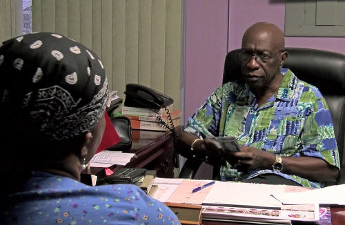 Photo: "Two for me, none for you, two for me, none for you..." Former ILP political leader and FIFA vice president Jack Warner shares the wealth. (Copyright Diego Urdanete/AFP 2015)