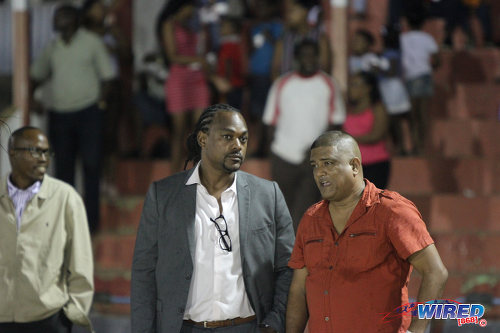 Photo: Former Sport Minister and Central FC chairman Brent Sancho (centre) watches WPL action in Sangre Grande with Japs Fried Chicken and North East Stars owner Darryl Mahabir. (Courtesy Sinead Peters/Wired868)