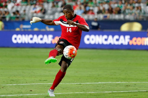 Photo: Trinidad and Tobago midfielder Andre Boucaud volleys home the second goal in their 2-0 win over Cuba at the 2015 CONCACAF Gold Cup. (Copyright Christian Peterson/AFP 2015)