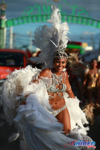 Photo: A Tribe masquerader enjoys herself on Carnival Tuesday in 2015. (Courtesy Allan V Crane/Wired868)